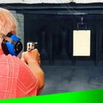 an older man target practice at gun range